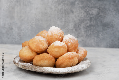 Baursak - traditional Kazakh (Asia) food  national bread in plate on marble  background