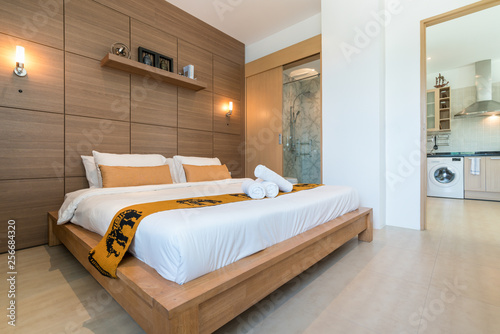 Luxury Interior design in bedroom of pool villa with cozy king bed. Bedroom with high raised ceiling  home  house  building