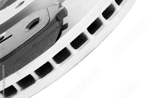 Brake discs and brake pads isolated on white background. Auto parts. Brake disc rotor isolated on white. Braking disk. Car part. Car detailing. Spare parts. Black and white