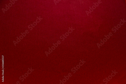 Beautiful red paper background. Empty space concept.Red paper texture background. Colored cardboard fibers and grain.