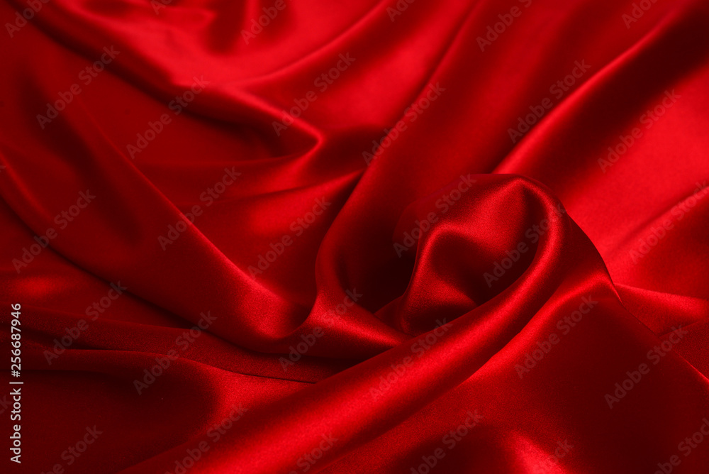 Red silk or satin luxury fabric texture can use as abstract background. Top view. Red silk or satin luxury fabric texture can use as abstract background. Top view.