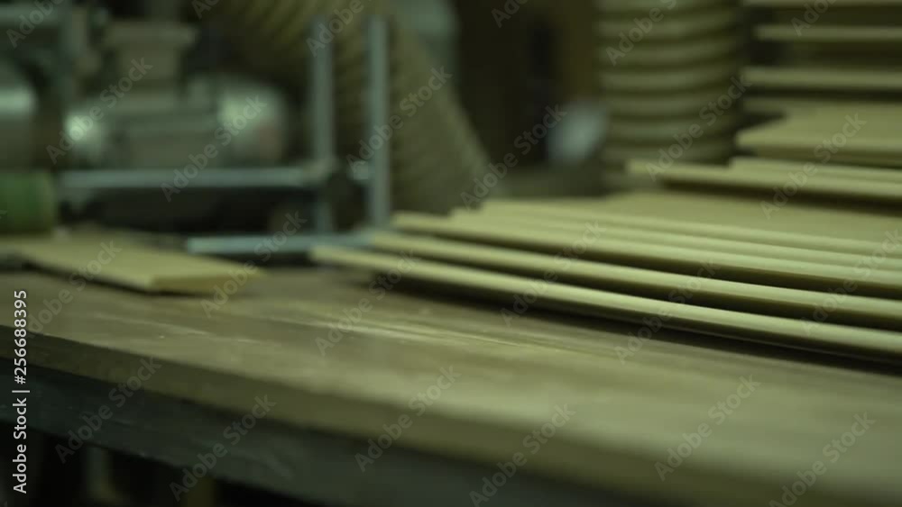 Shooting of gluing of a film on a plinth. The worker gives a plinth to ...