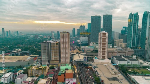 Night to morning view of Mandaluyong, the business district of Metro Manila city, Luzon island, Philippines. Manila, Luzon, Philippines - February, 2019. Aerial view Timelapse 4K photo