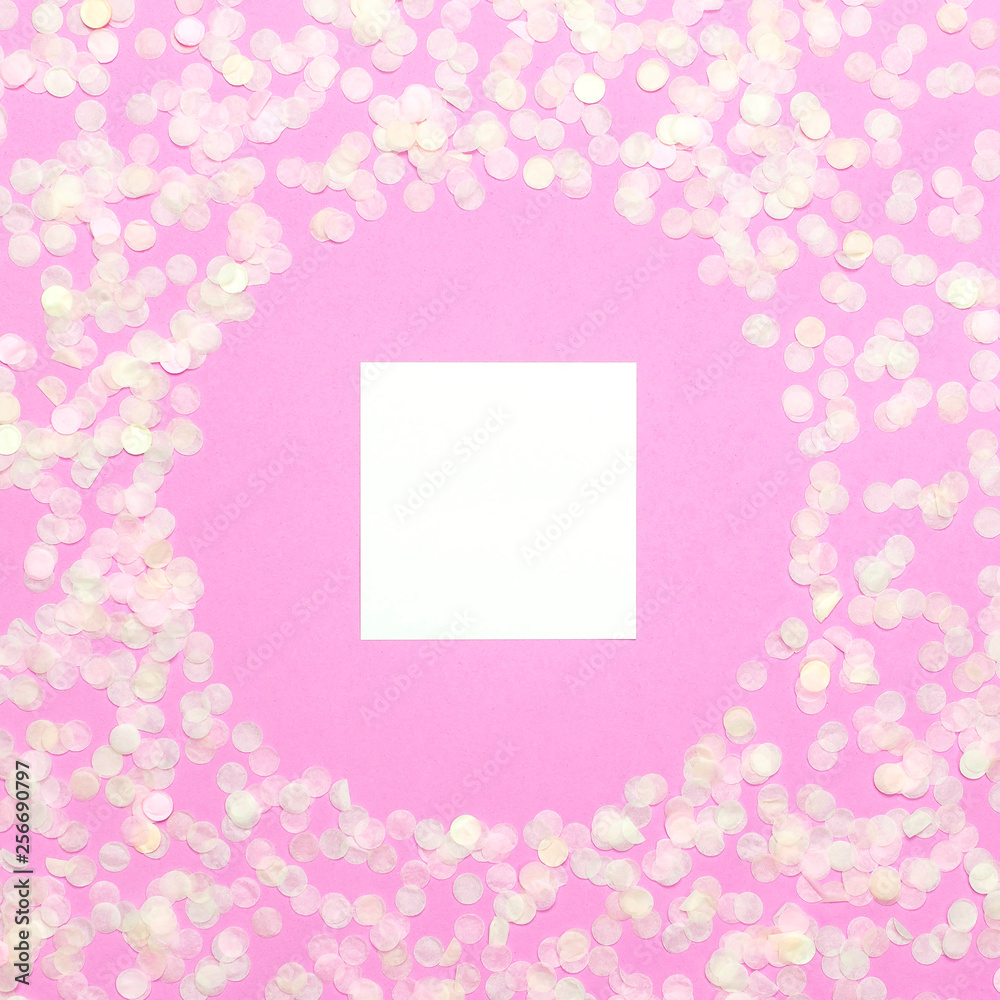 Frame of paper round confetti with clear circle in the middle on pastel pink background top view Flat lay. Festive holiday background, concept of party, birthday, christmas or new year Frame of paper round confetti with clear circle in the middle on pastel pink background top view Flat lay. Festive holiday background, concept of party, birthday, christmas or new year