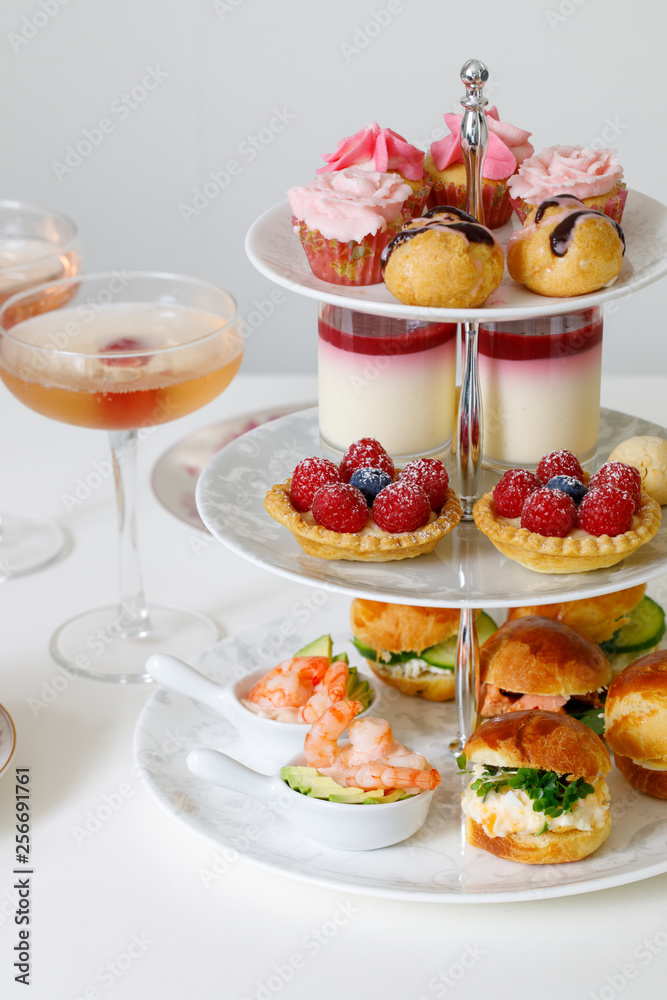 Afternoon tea with mini brioche canapes and selection of sweets