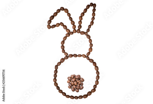 Easter bunny made of freshly roasted coffee beans on a white background. Creative easter concept. photo