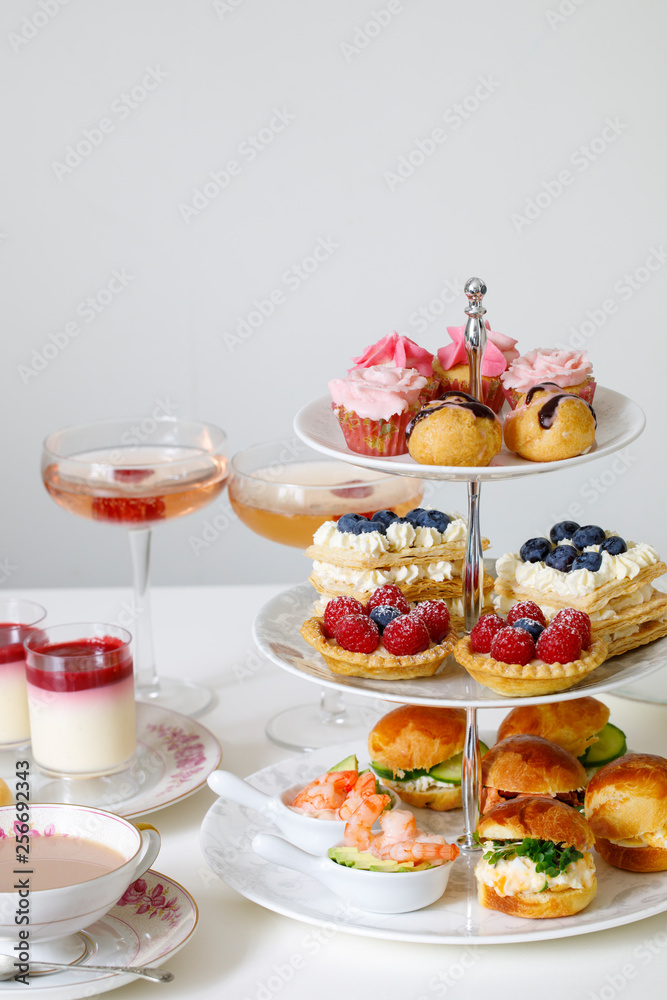Afternoon tea with mini brioche canapes and selection of sweets Afternoon tea with mini brioche canapes and selection of sweets