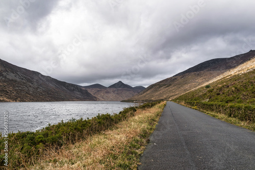Road along a mountain lake