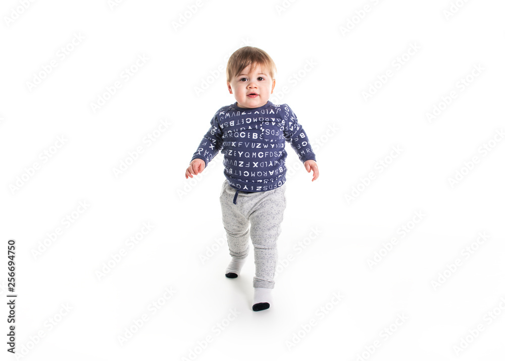 A One year old boy walk on studio white background A One year old boy walk on studio white background