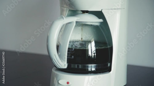 Home Coffee Machine Making Coffee. Filling Pot.