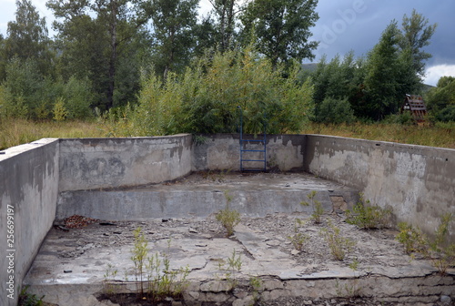 Abandoned swimming pool in the tourist complex "Eldorado" at the mouth of the river Ini Altai Krai