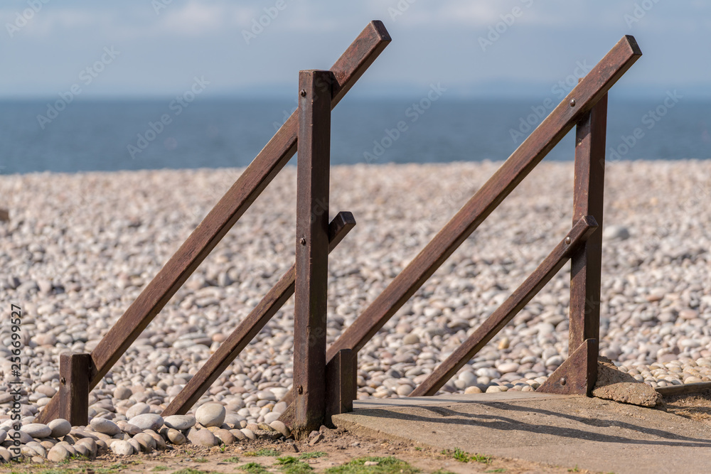 Handrails on the pebble beach of Budleigh Salterton, Jurassic Coast, Devon, UK Handrails on the pebble beach of Budleigh Salterton, Jurassic Coast, Devon, UK