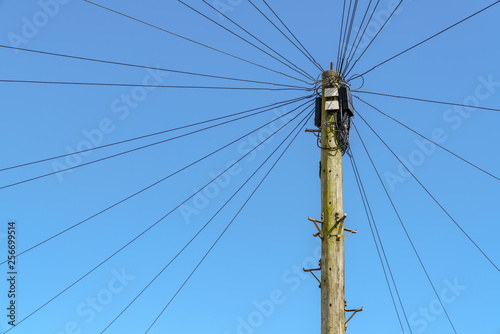 Power cables and power pole, seen in Exmouth, Devon, England, UK