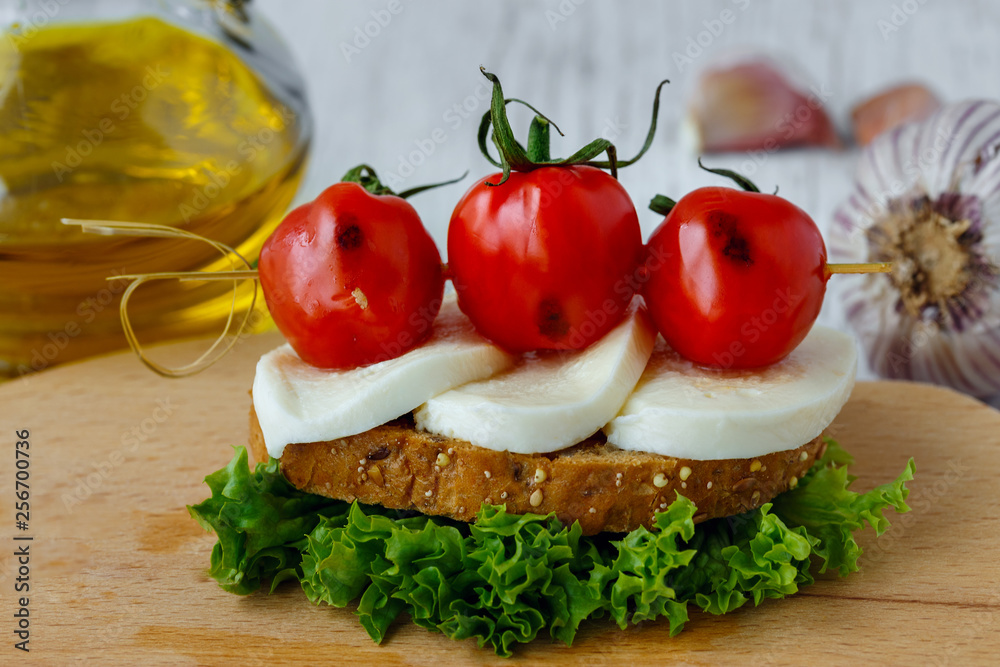 Bruschetta with mozzarella and cherry tomatoes Bruschetta with mozzarella and cherry tomatoes