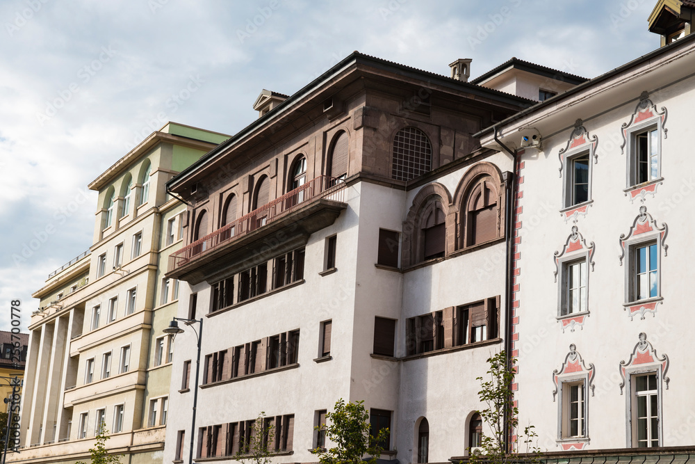 Naklejka premium white apartments with brown shutters in Bolzano, Italy