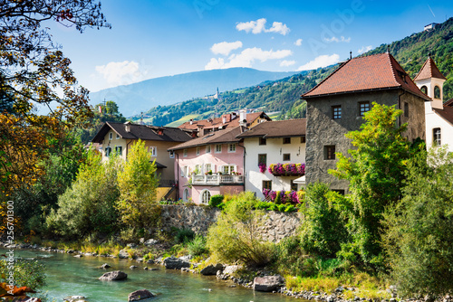 colorful houses along river Isarco (Eisack), Chiusa, Italy photo