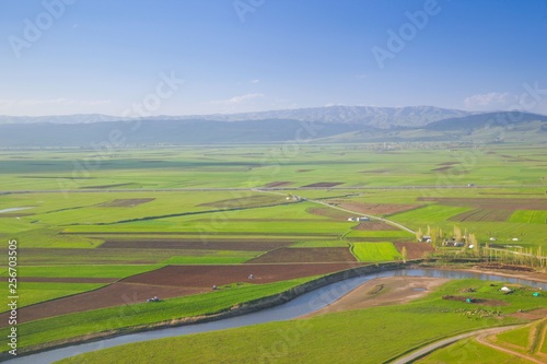 Meandering stream with mountains and clouds at The Persembe Plateau at Ordu, Turkey 