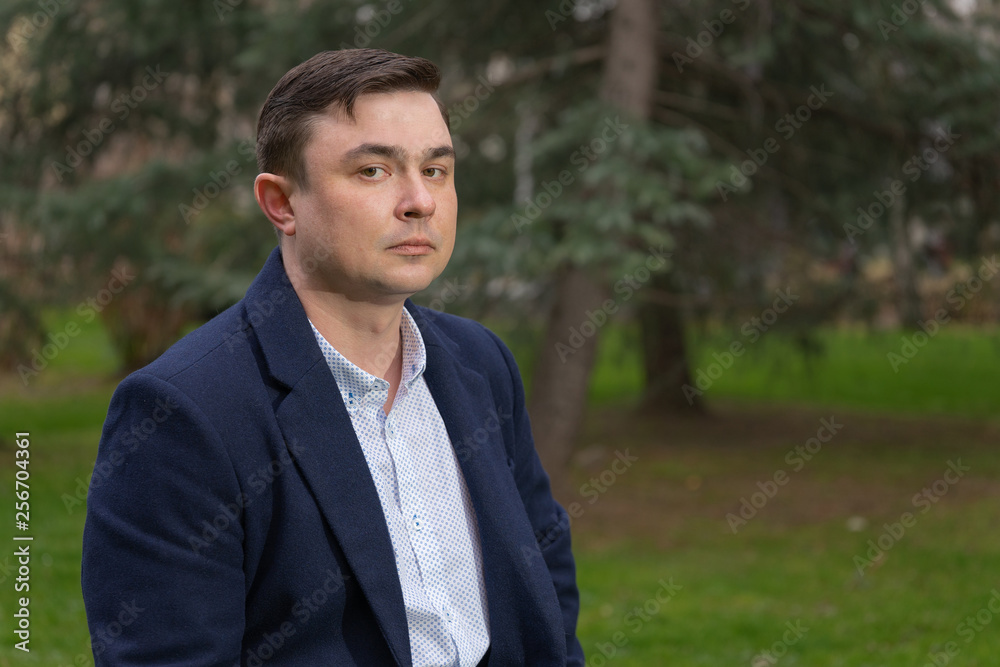 Portrait of a businessman in the park Close up