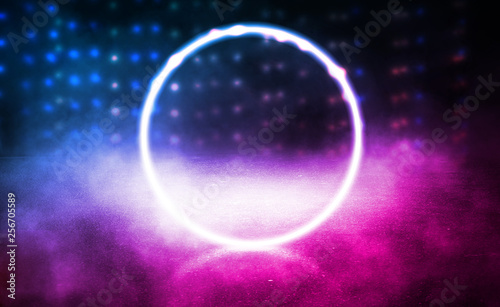 Background of empty stage  room. Reflection on wet pavement  concrete. Neon blurry lights. Neon circle figure in the center  smoke