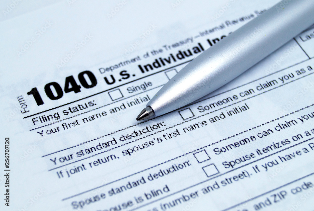Income tax form with pen.