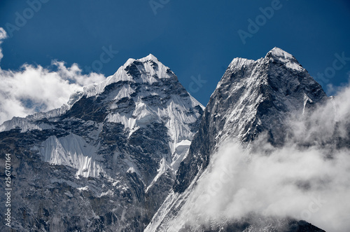 huge Himalayan mountain  amadablam with a glaciers in Nepal photo