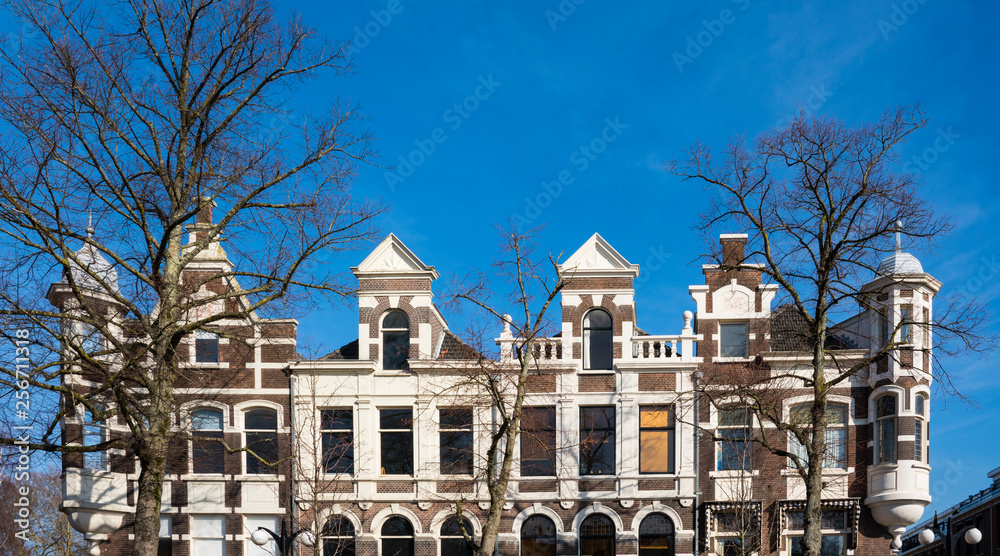 facades of houses in street Vrieseplein, Dordrecht, The Netherlands