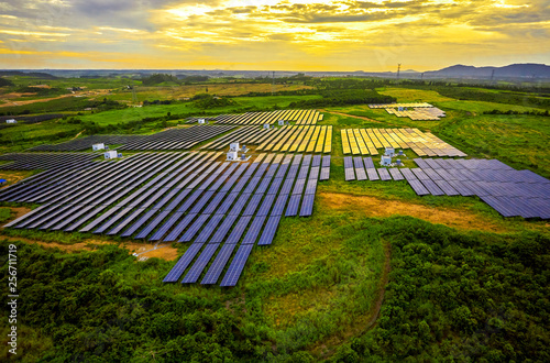 Foto Solar photovoltaic panel with aerial green vegetation base