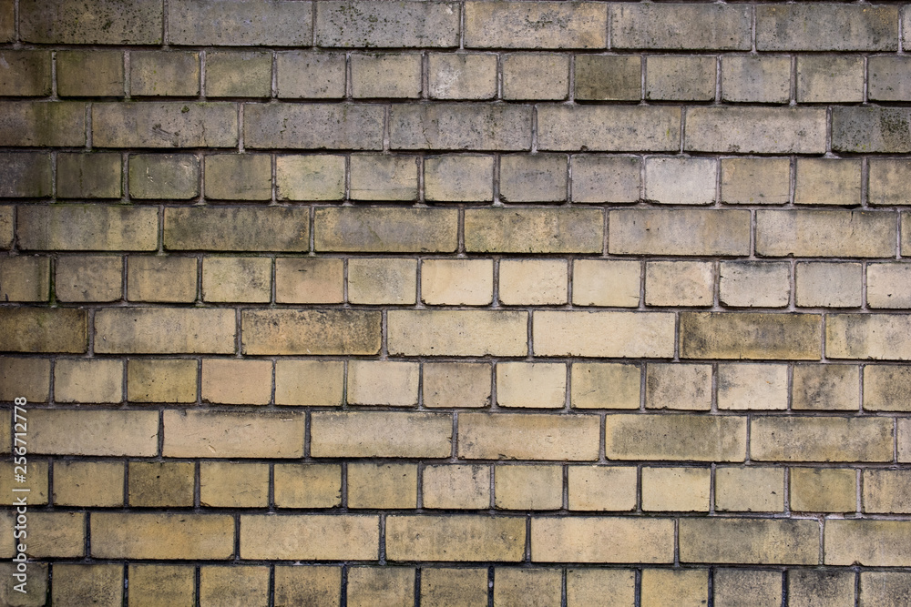wall of old yellow bricks