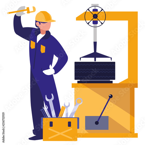 mechanic worker with tire changer machine