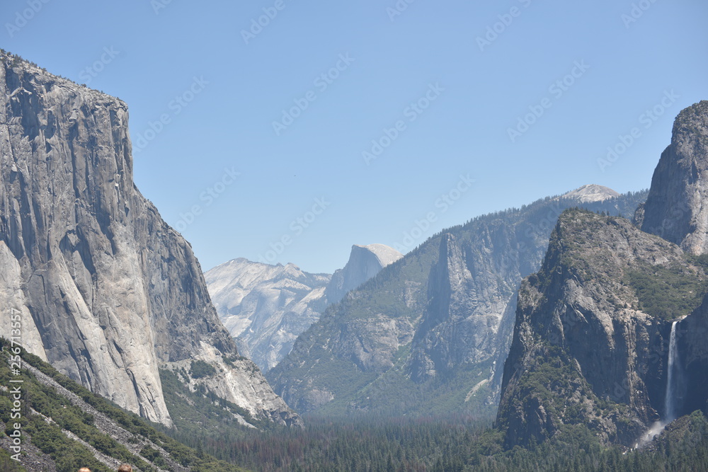 Fototapeta premium Yosemite National Park, CA., U.S.A. June 26, 2017. Panorama view of Yosemite Valley from the tunnel showing El Capitan, Half-dome, Bridalveil Falls.