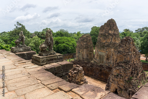 Sculpted lions standing guard over the Pre Rup temple near Angkor Wat