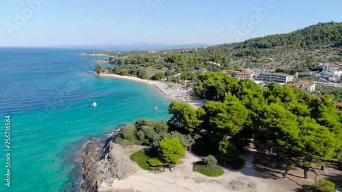 Wallpaper Mural Aerial drone view of blue sea surface on sandy beach surrounded with trees. Top view of transparent turquoise ocean water surface, seashore, forest. Torontodigital.ca