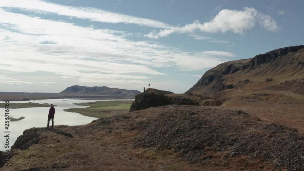 Aerial drone shot of people standing on a cliff by the Þjórsá river in Highlands of Iceland Aerial drone shot of people standing on a cliff by the Þjórsá river in Highlands of Iceland