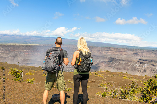 The Hiking couple seeing volcano national park from crater on the caldera Halemaumau around Hawaii volcanoes national park