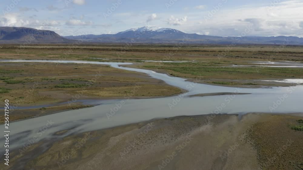 Aerial drone shot over Þjórsá river towards Hekla volcano in Iceland in summer Aerial drone shot over Þjórsá river towards Hekla volcano in Iceland in summer