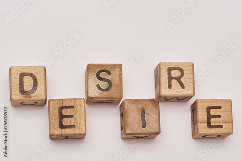 wooden cubes on a white background and various chaotic letters photo