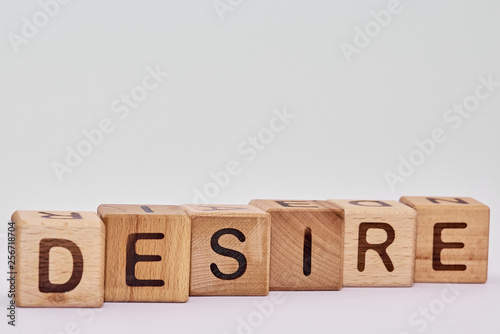 wooden cubes on a white background and various chaotic letters photo