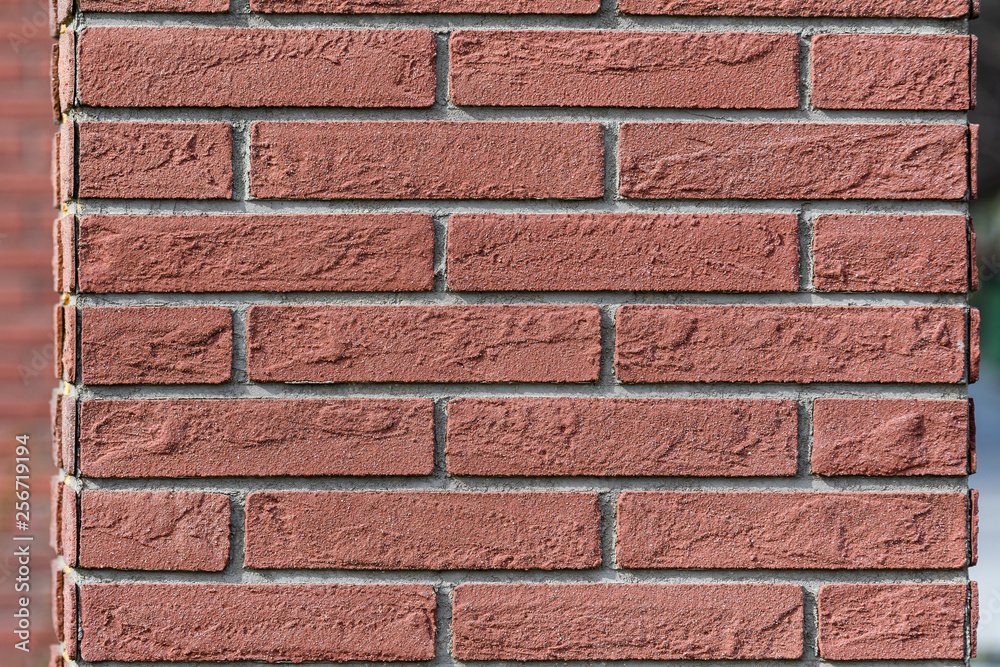 Fototapeta premium Background of red cement bricks in direct sun light, geometrical pattern