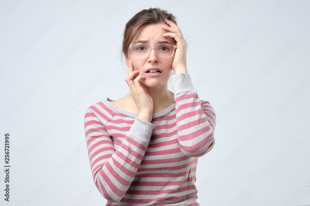 Portrait of a worried woman. Isolated white background. Portrait of a worried woman. Isolated white background.