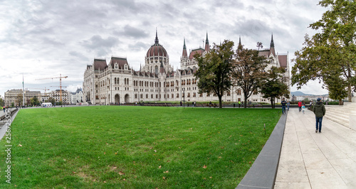  Panoramic view of the side of the Budapest Parliament with the grass in the foreground, Hungary