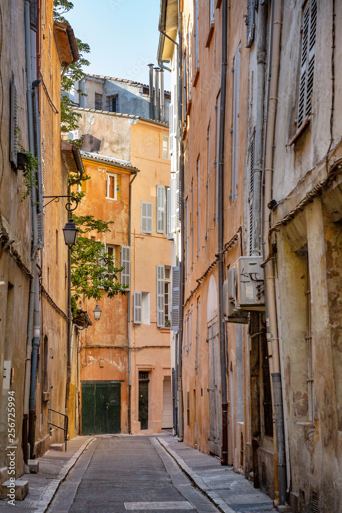 Narrow street in the charming old city of Aix-en-Provence, France