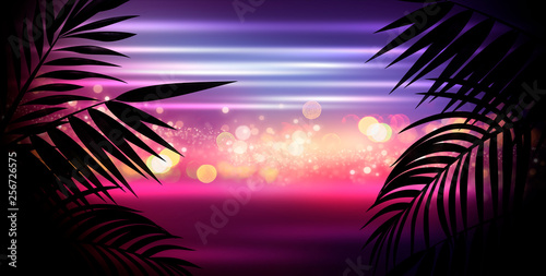 Dark background with colorful bokeh of tropical leaves. Night view, gradient and abstract bokeh light. Magic twinkling sparkles.