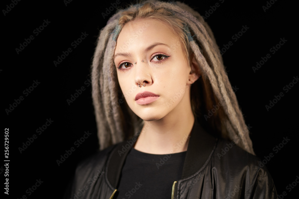 beautiful girl in a black jacket stylish on a black backgroundon black background beautiful girl in a black jacket stylish on a black backgroundon black background