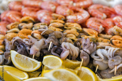 Appetizing skewers of seafoods closeup. © Panama