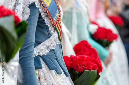 Flowers for the Virgin in the offering of the fallas of Valencia. Falleras dress photo