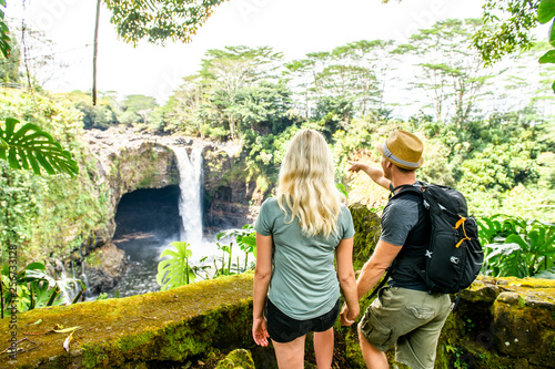 A couple at The Rainbow Falls, Hilo, Wailuku River State Park, Big Island, Hawaii photo