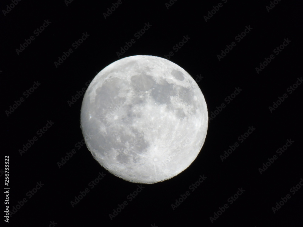 Genova, Italy - 03/20/2019: An amazing photography of the full moon over the city of Genova by night with a great clear sky in background and some stars Genova, Italy - 03/20/2019: An amazing photography of the full moon over the city of Genova by night with a great clear sky in background and some stars
