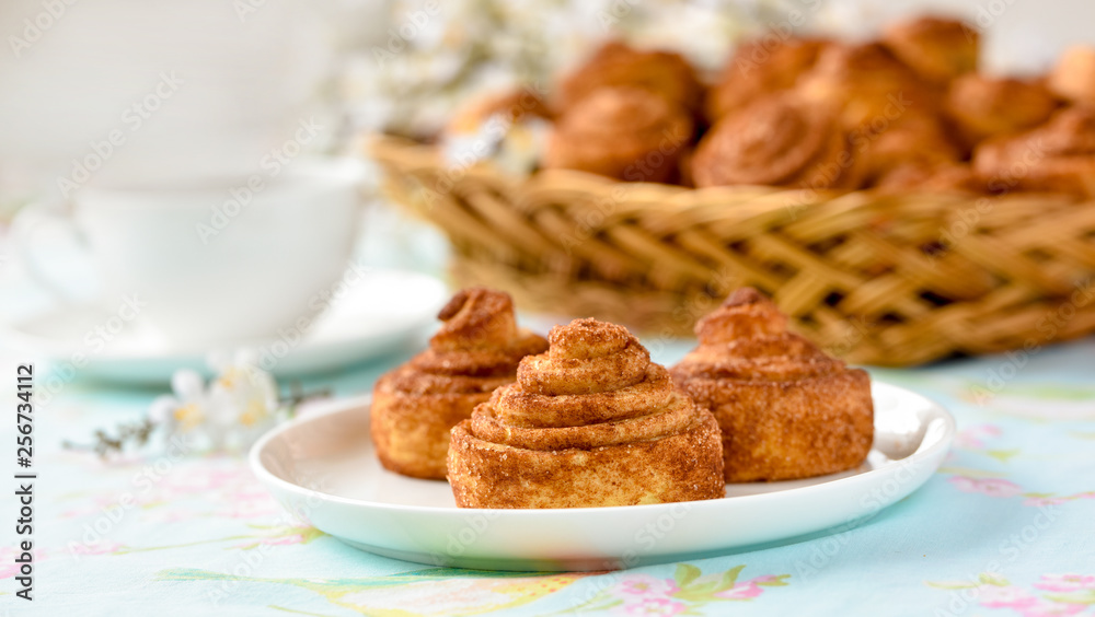 Homemade cinnamon buns cakes on a table Homemade cinnamon buns cakes on a table