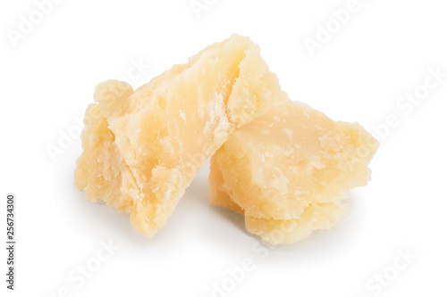 Parmesan cheese pieces isolated on white background. Closeup