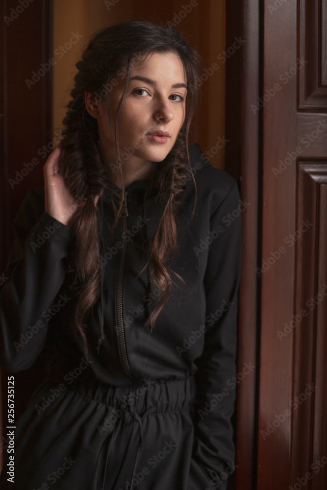 Portrait of young beautiful cute cheerful girl looking and posing for camera over background Portrait of young beautiful cute cheerful girl looking and posing for camera over background